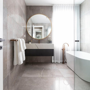 This is an example of a contemporary master bathroom in Sydney with flat-panel cabinets, a freestanding tub, a curbless shower, an integrated sink, marble benchtops, multi-coloured floor, a hinged shower door, multi-coloured benchtops, a single vanity and a floating vanity.