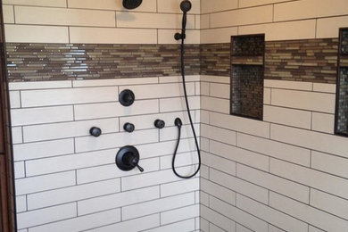 Example of a large master white tile and ceramic tile porcelain tile bathroom design in Minneapolis with a one-piece toilet and beige walls