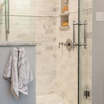 Walk in Shower with Marble Subway Tile and Frame less Door