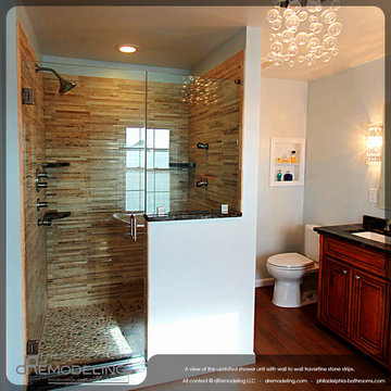 Walk in shower with mosaic wall tile