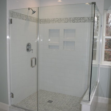 Walk in shower with rain head and custom tile work.