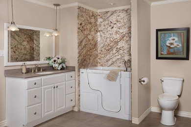 Inspiration for a mid-sized transitional master brown tile and stone slab ceramic tile and brown floor tub/shower combo remodel in Miami with raised-panel cabinets, white cabinets, a two-piece toilet, brown walls, an undermount sink, granite countertops and a hinged shower door