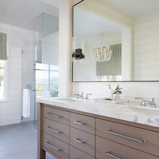 Country bathroom in San Francisco with flat-panel cabinets, light wood cabinets, white walls, an undermount sink, grey floor, white benchtops, a double vanity, a freestanding vanity, timber and planked wall panelling.