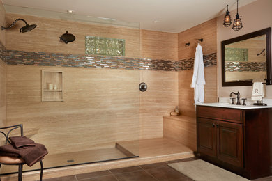 Bathroom - mid-sized transitional master porcelain tile porcelain tile and beige floor bathroom idea in San Diego with raised-panel cabinets, dark wood cabinets, solid surface countertops, beige walls and an integrated sink