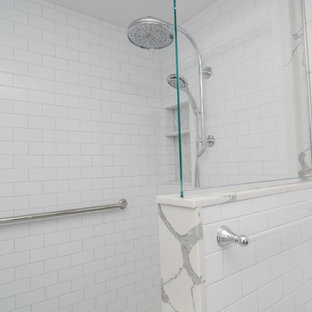 Cette image montre une petit salle de bain principale traditionnelle avec un placard avec porte à panneau encastré, des portes de placard grises, une douche à l'italienne, un WC séparé, un carrelage blanc, un carrelage métro, un mur gris, un sol en marbre, un lavabo encastré, un plan de toilette en surface solide, un sol gris, aucune cabine et un plan de toilette vert.