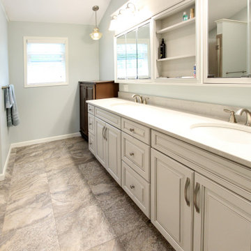 Warm Gray Vanity with Maple Truffle Accent Linen Cabinet and Tiled Shower
