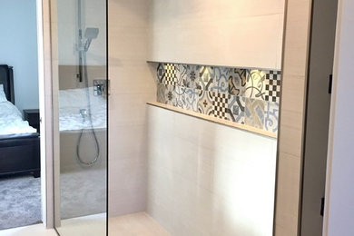 This is an example of a large modern ensuite bathroom in Other with shaker cabinets, blue cabinets, a walk-in shower, a two-piece toilet, white tiles, porcelain tiles, grey walls, porcelain flooring, a submerged sink, quartz worktops, white floors, an open shower and grey worktops.