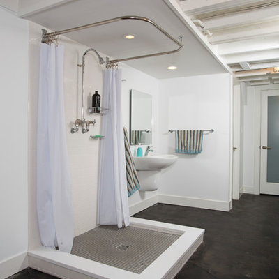 Bathroom - large industrial concrete floor and black floor bathroom idea in DC Metro with white walls