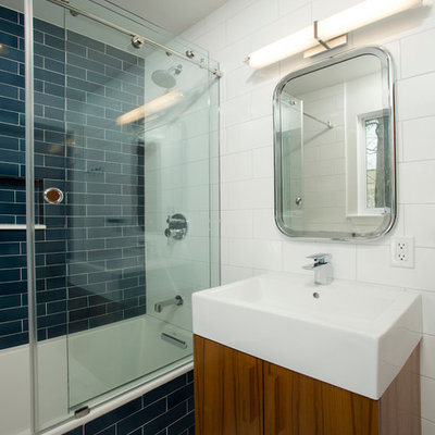 Inspiration for a mid-sized eclectic kids' blue tile and ceramic tile mosaic tile floor bathroom remodel in DC Metro with flat-panel cabinets, medium tone wood cabinets, a one-piece toilet, white walls and a vessel sink