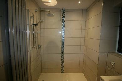 Photo of a small modern shower room bathroom in Sussex with beaded cabinets, white cabinets, beige tiles, porcelain tiles, porcelain flooring and beige floors.