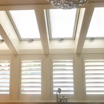 We love all the windows in this bathroom! Motorized solar shades on top and Shut