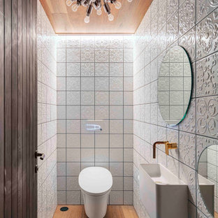 This is an example of an industrial bathroom in Newcastle - Maitland with wood.