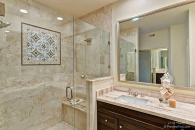 Transitional 3/4 beige tile bathroom photo in San Diego with recessed-panel cabinets, dark wood cabinets and limestone countertops