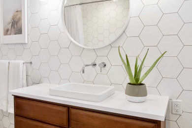 Bathroom - mid-sized 1960s kids' white tile and porcelain tile porcelain tile and single-sink bathroom idea in Vancouver with furniture-like cabinets, medium tone wood cabinets, a vessel sink, quartz countertops, white countertops and a freestanding vanity