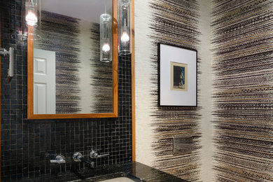 Imagen de cuarto de baño moderno pequeño con armarios con paneles lisos, puertas de armario marrones, sanitario de pared, baldosas y/o azulejos de vidrio, suelo de mármol, lavabo bajoencimera, encimera de granito y suelo gris