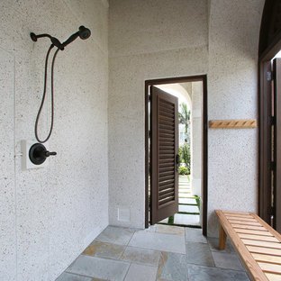 Bathroom - tropical bathroom idea in Tampa with an undermount sink and a one-piece toilet