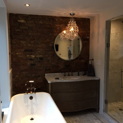 Mid-sized mountain style master mosaic tile floor bathroom photo in New York with marble countertops