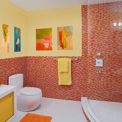 Corner shower - contemporary mosaic tile and red tile corner shower idea in New York with yellow cabinets and red walls