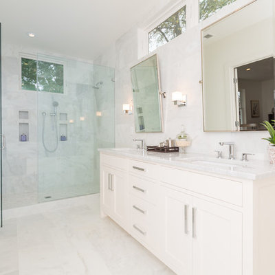 Example of a transitional white tile alcove shower design in DC Metro with an undermount sink, shaker cabinets and white cabinets