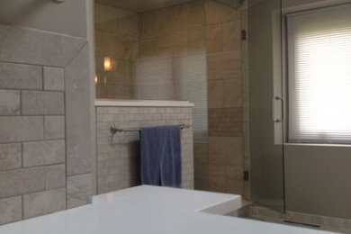 Example of a transitional porcelain tile japanese bathtub design in Chicago with quartz countertops