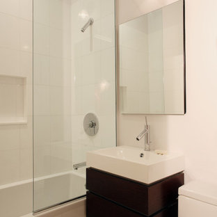 Inspiration for a contemporary bathroom remodel in New York with a wall-mount sink