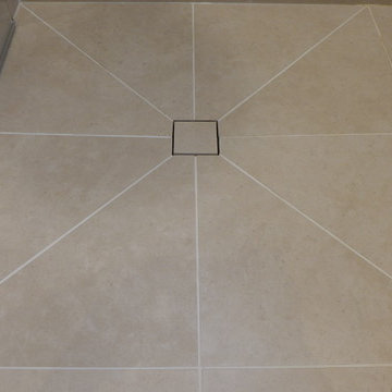 wet room shower floor tile design to central drain