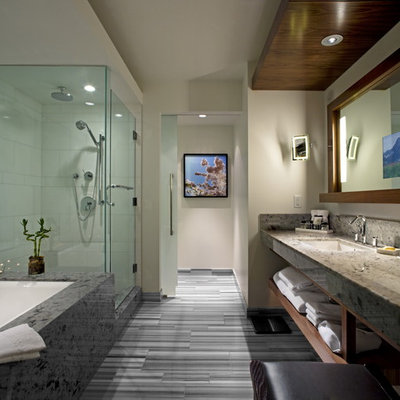 Corner shower - large contemporary master white tile and porcelain tile corner shower idea in Vancouver with open cabinets, dark wood cabinets, an undermount tub, a two-piece toilet, white walls, an undermount sink and granite countertops