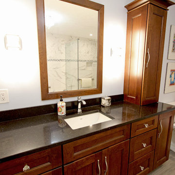 White and Gray MasterBath with Marble Look and Herringbone Tiled Shower
