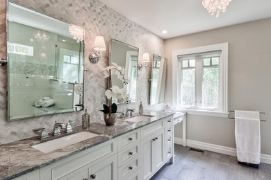 Example of a transitional master marble tile porcelain tile bathroom design in Other with flat-panel cabinets, white cabinets and gray walls