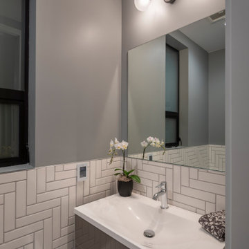 White Bathroom Tiles in Herringbone