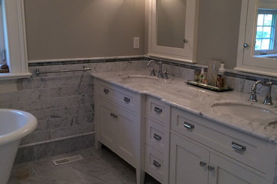 Inspiration for a timeless master gray tile and subway tile marble floor corner shower remodel in Toronto with an undermount sink, shaker cabinets, white cabinets, marble countertops, a one-piece toilet and gray walls