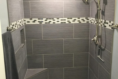 Transitional gray tile and porcelain tile corner shower photo