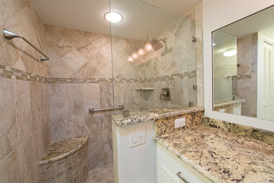 Bathroom - mid-sized traditional 3/4 beige tile and ceramic tile ceramic tile and beige floor bathroom idea in Miami with shaker cabinets, white cabinets, a two-piece toilet, white walls, an undermount sink, granite countertops and multicolored countertops