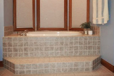 This is an example of a medium sized shower room bathroom in Cincinnati with a console sink, a one-piece toilet, white walls and ceramic flooring.