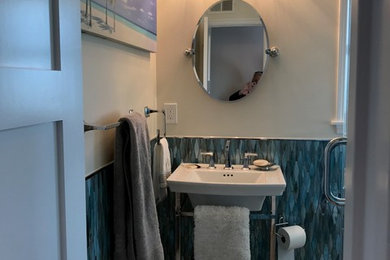 Inspiration for a mid-sized coastal 3/4 blue tile and glass tile porcelain tile corner shower remodel in Los Angeles with a one-piece toilet, beige walls and a console sink