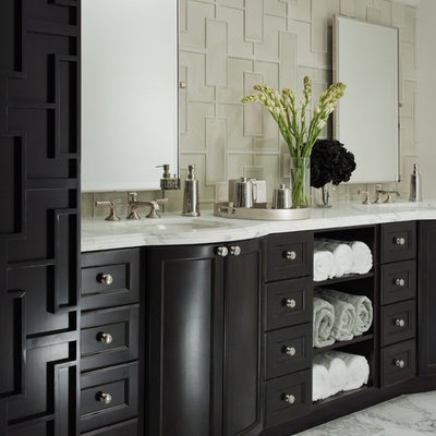 Trendy white tile bathroom photo in San Francisco with an undermount sink, recessed-panel cabinets and black cabinets