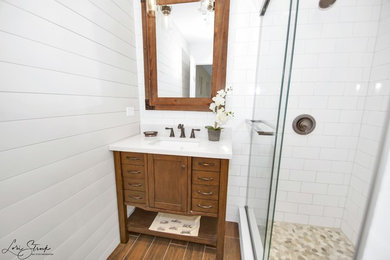 Example of a mid-sized country master ceramic tile ceramic tile and brown floor bathroom design in Chicago with a one-piece toilet, gray walls, an undermount sink, quartzite countertops and white countertops