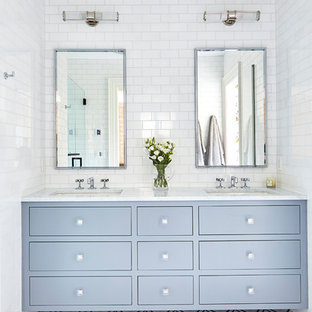 Mid-sized transitional master white tile and ceramic tile marble floor and multicolored floor alcove shower photo in Wilmington with flat-panel cabinets, gray cabinets, an undermount sink, marble countertops, a hinged shower door and white countertops