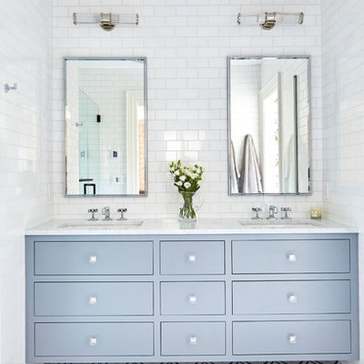 Mid-sized transitional master white tile and ceramic tile marble floor and multicolored floor alcove shower photo in Wilmington with flat-panel cabinets, gray cabinets, an undermount sink, marble countertops, a hinged shower door and white countertops