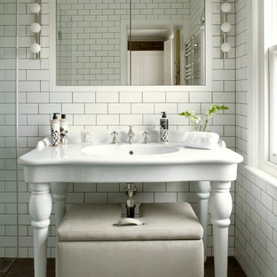 Mid-sized victorian master bathroom in London with a console sink, white tile, subway tile, flat-panel cabinets, white cabinets, an open shower, a wall-mount toilet, white walls, slate floors, grey floor and a hinged shower door.