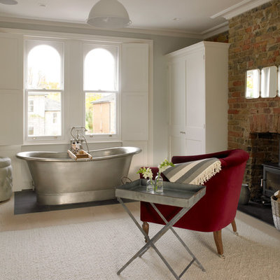 Freestanding bathtub - huge victorian light wood floor and beige floor freestanding bathtub idea in London with white walls