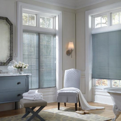 Example of a large cottage chic master gray tile and white tile light wood floor freestanding bathtub design in Baltimore with flat-panel cabinets, blue cabinets, a two-piece toilet, beige walls, a drop-in sink and marble countertops