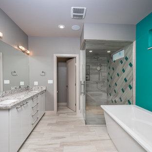 Large minimalist master beige tile and ceramic tile ceramic tile bathroom photo in Other with flat-panel cabinets, white cabinets, granite countertops, gray walls, a two-piece toilet and an undermount sink