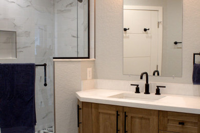 This is an example of a medium sized retro ensuite bathroom in Orlando with shaker cabinets, medium wood cabinets, a double shower, grey walls, engineered stone worktops, white floors, a hinged door, white worktops, double sinks and a built in vanity unit.