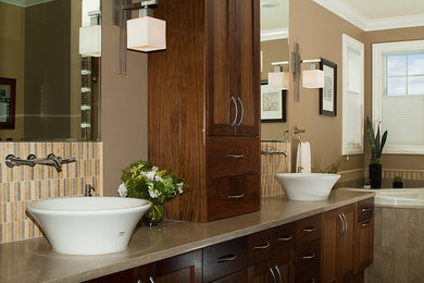 Corner bathtub - mid-sized transitional master multicolored tile and stone tile corner bathtub idea in Seattle with a vessel sink, shaker cabinets, medium tone wood cabinets, limestone countertops and beige walls