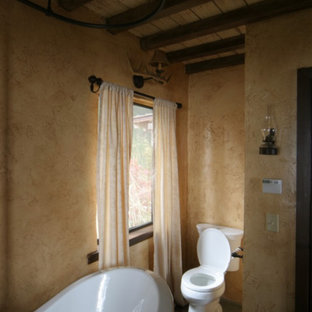 Bathroom - mid-sized french country master slate floor and multicolored floor bathroom idea in Other with open cabinets, a two-piece toilet, beige walls, a vessel sink, solid surface countertops and multicolored countertops