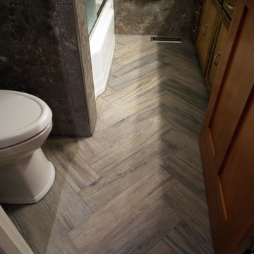 Wood-like porcelain tile laid in a chevron pattern