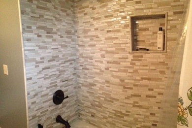 Bathroom - small contemporary kids' multicolored tile and mosaic tile porcelain tile bathroom idea in Cincinnati with an undermount sink, furniture-like cabinets, dark wood cabinets, quartzite countertops, a two-piece toilet and blue walls