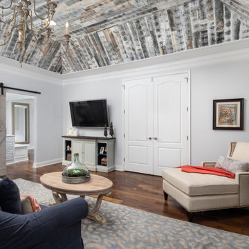 Wood Tray Ceiling with Pops of Coral Master Suite