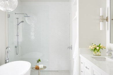 Example of a large transitional master white tile and ceramic tile porcelain tile and white floor bathroom design in Toronto with a one-piece toilet, white walls, an undermount sink, quartz countertops, white countertops, recessed-panel cabinets and white cabinets